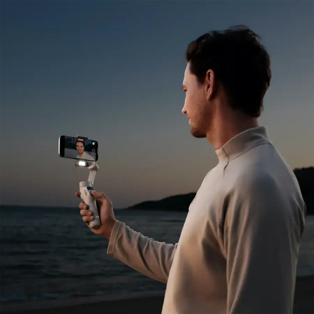 DJI Osmo Mobile 7 – 3-Axis Gimbal Stabilizer with Intelligent Tracking, Built-In Tripod, AI Editing, and 10-Hour Battery Life